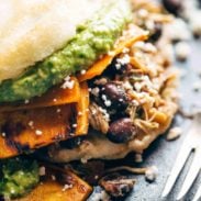 Arepas on a plate with a fork.