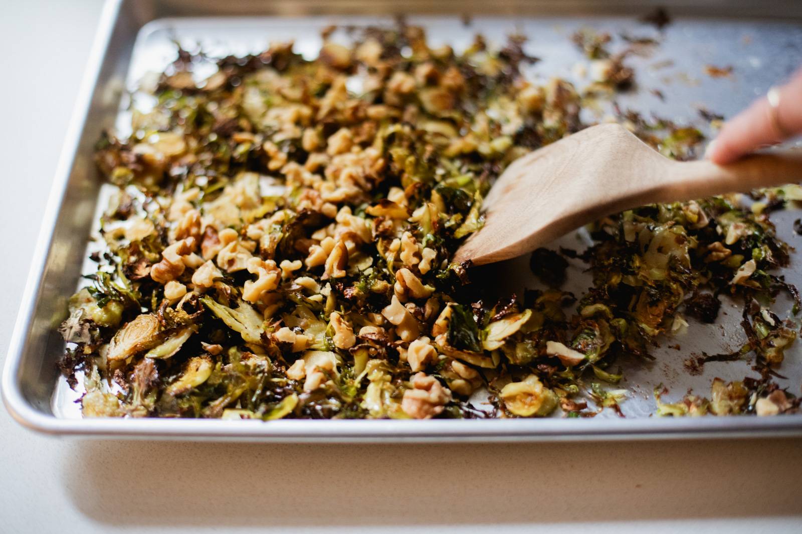 Roasted brussels sprouts on a sheet pan.