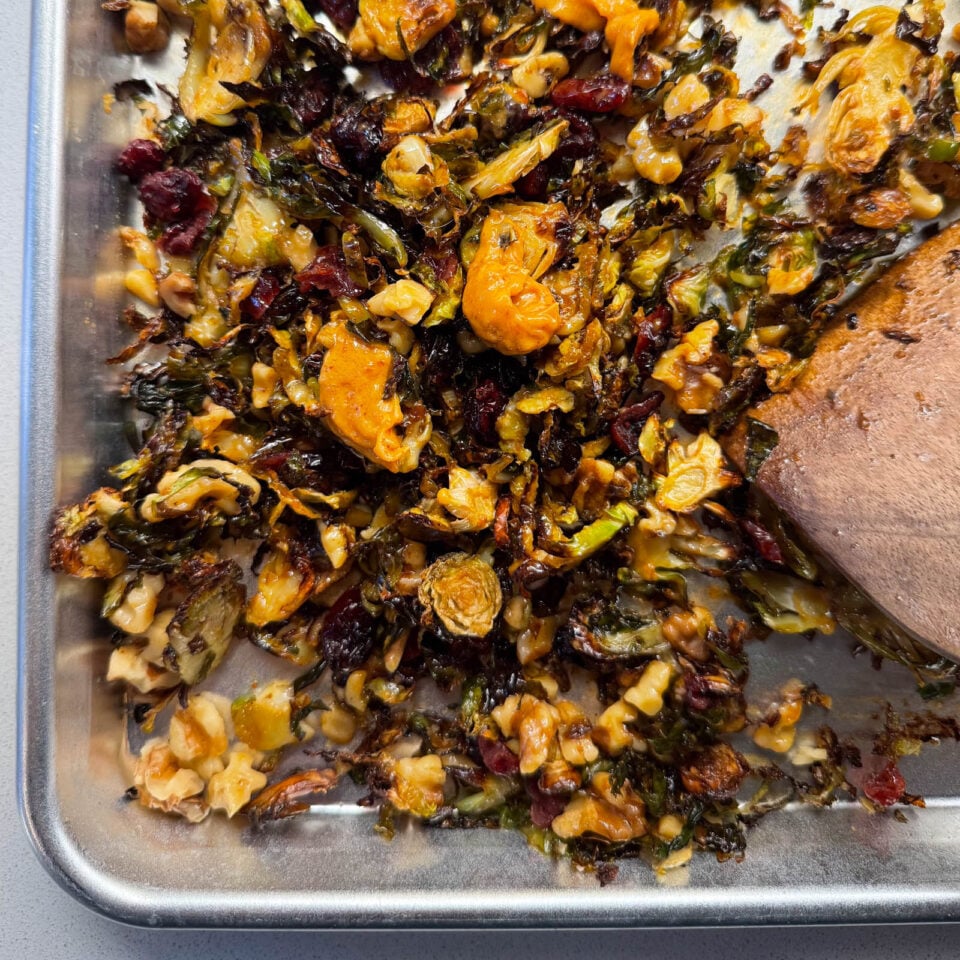 Roasted brussels sprouts on a sheet pan.