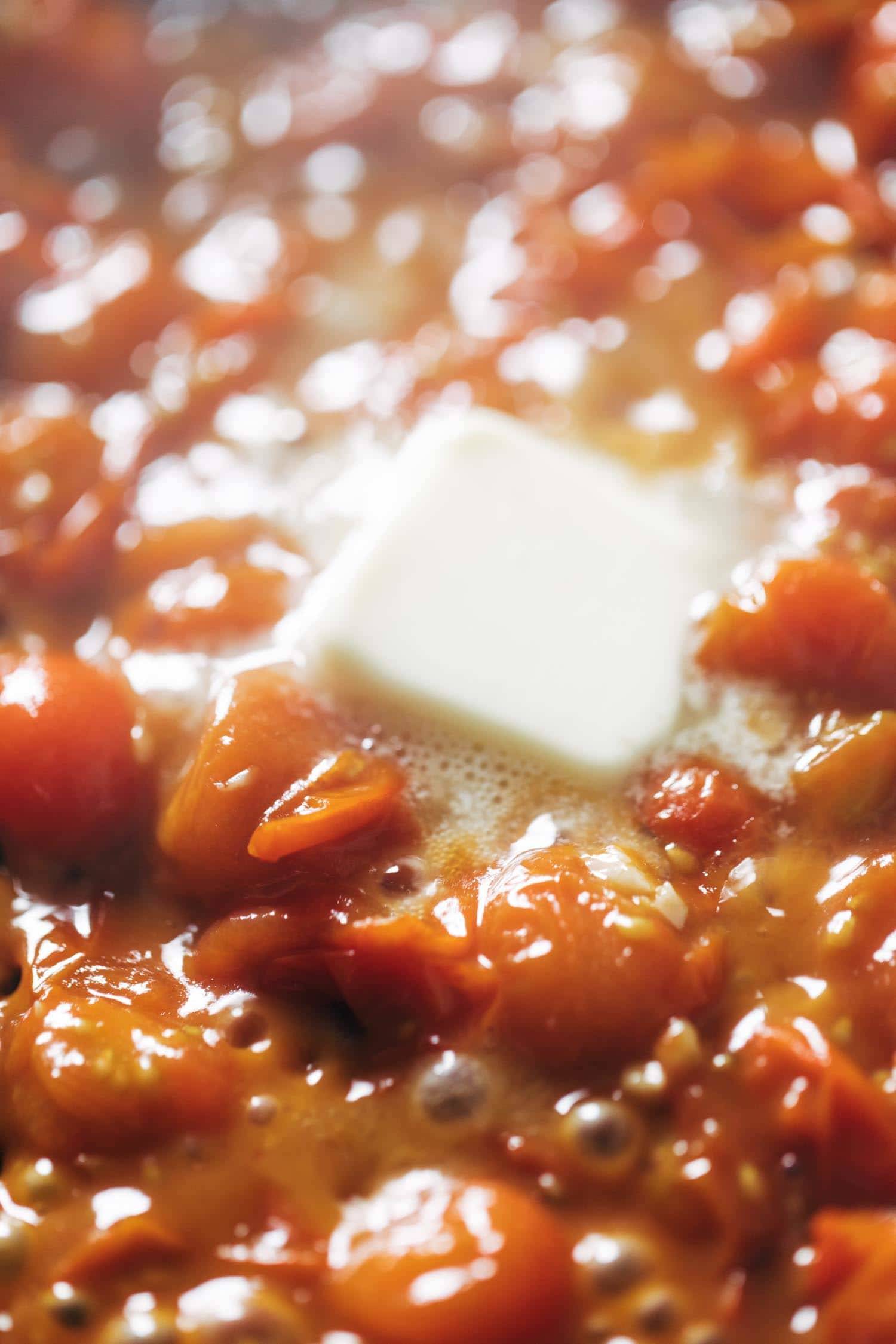 Tomatoes simmering with butter.