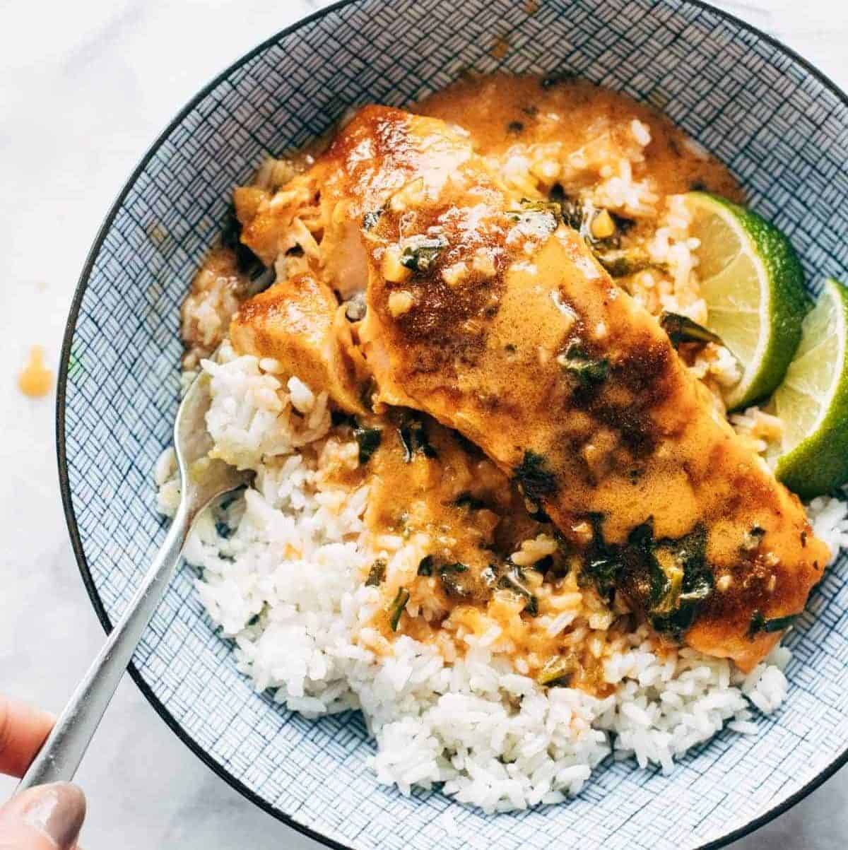 Coconut curry salmon in a bowl with rice.