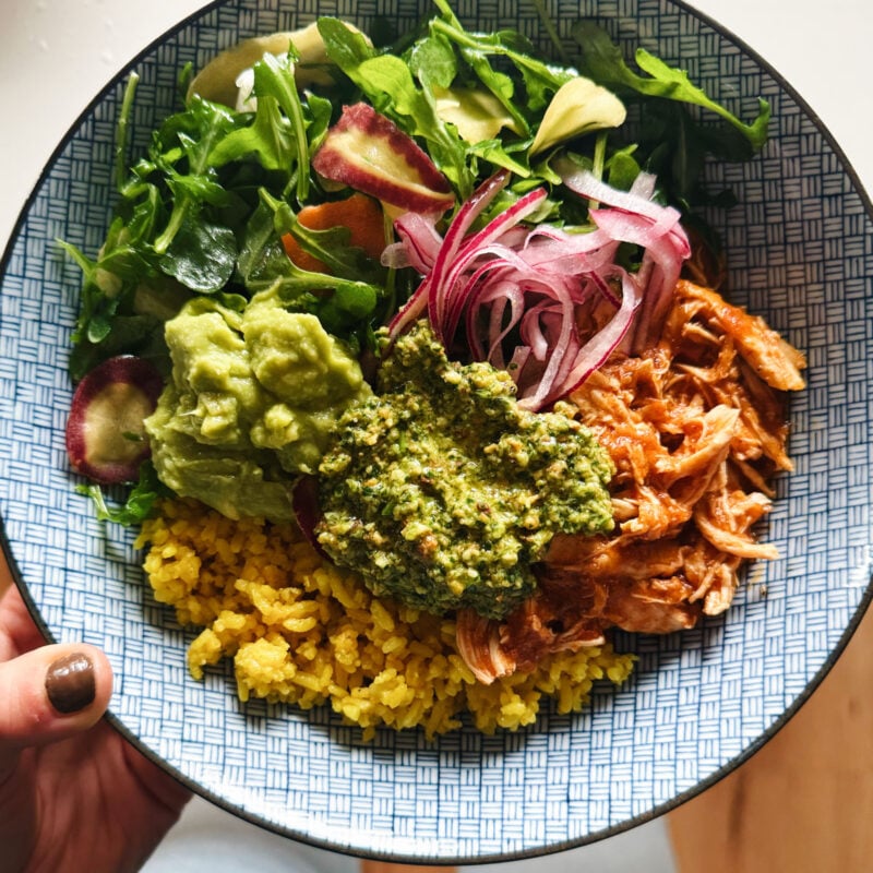 A picture of Crockpot Chicken Bowls with Yellow Rice and Cilantro Pesto