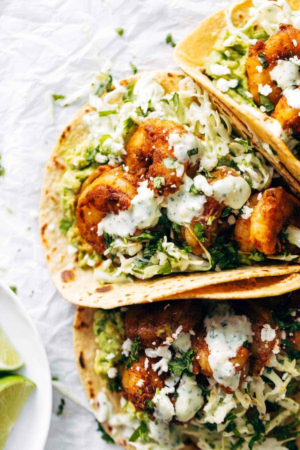 Shrimp tacos with sauce.