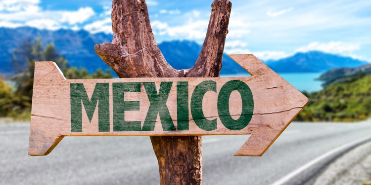 Sign Pointing to Mexico