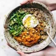 Healing Bowl with sweet potatoes, rice and arugula.