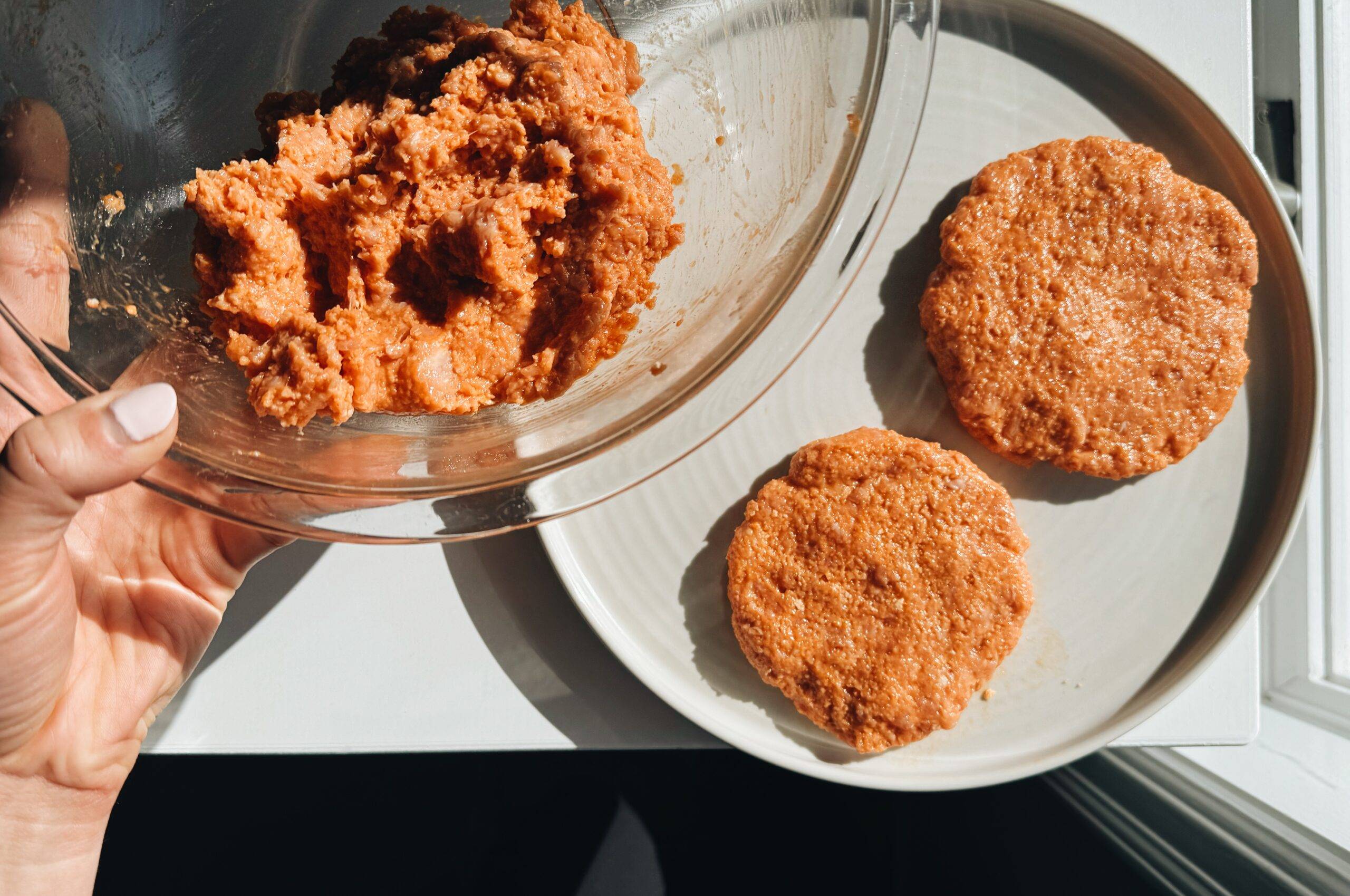 Forming patties for buffalo chicken burgers.