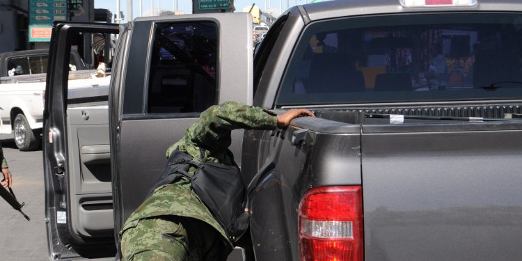 Soldier Checks Vehicle in Mexico