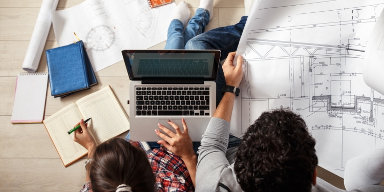 Couple reviewing a property plan