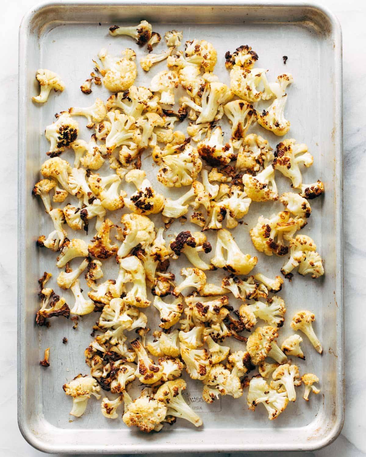 Roasted cauliflower on a pan.