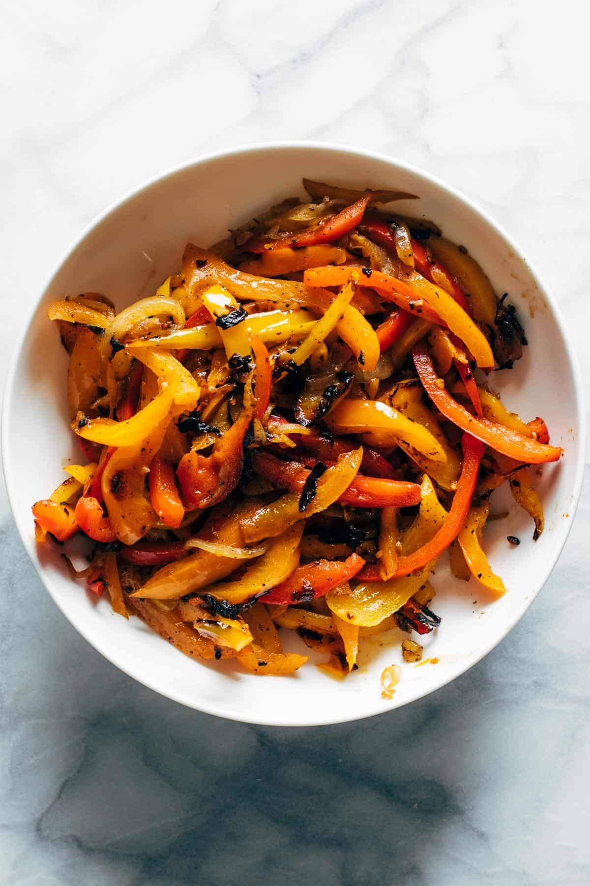 Grilled peppers in a bowl.