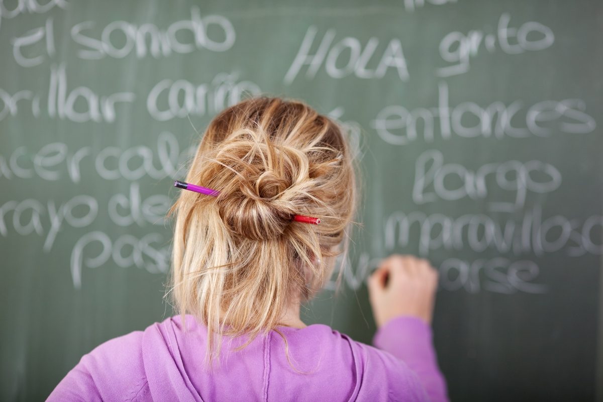 Writing Spanish on a chalkboard