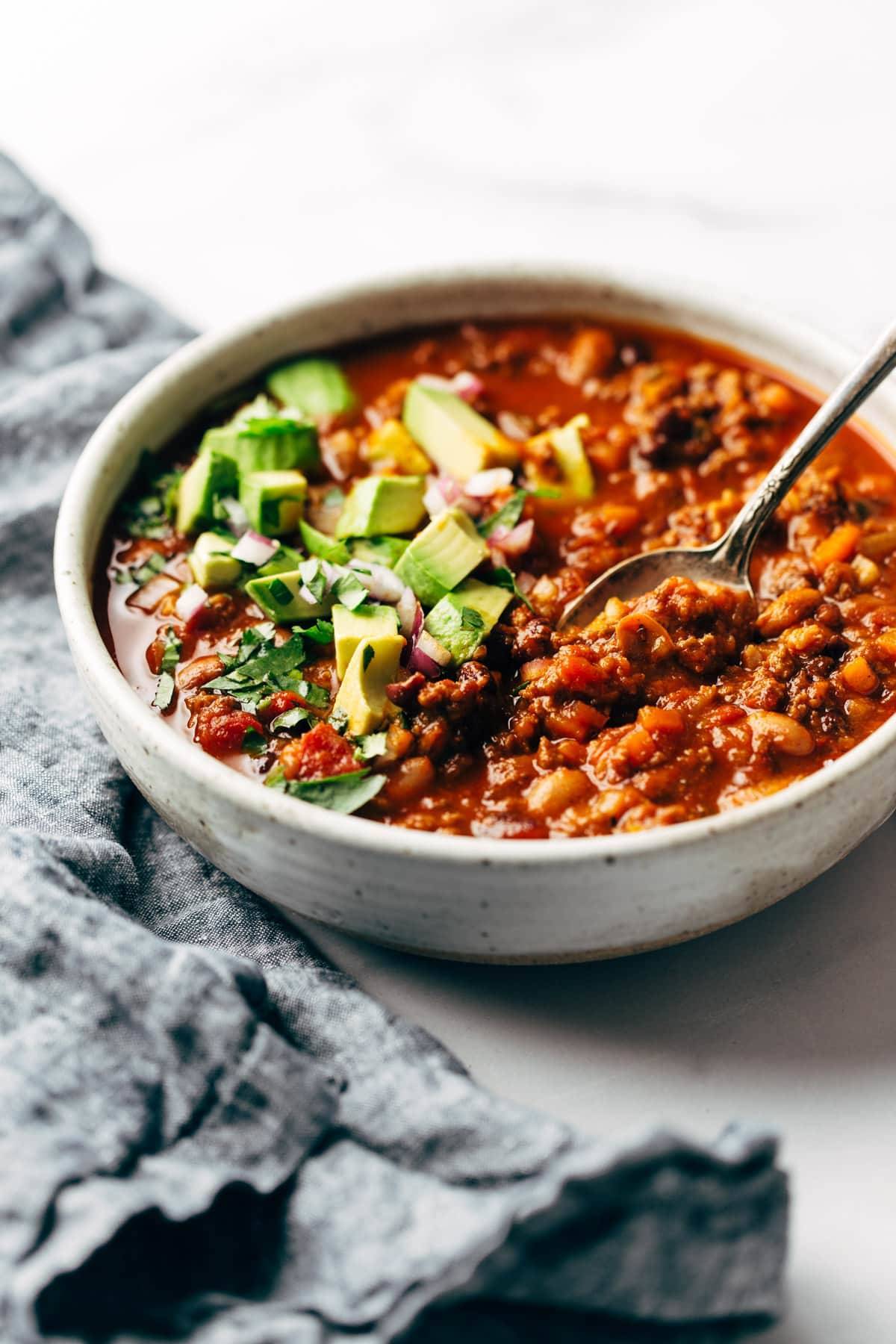 Sunday chili in a bowl with a spoon.