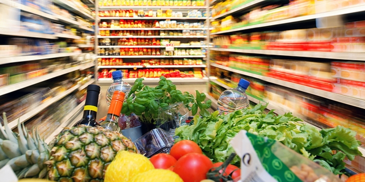 Supermarket trolley filled with groceries