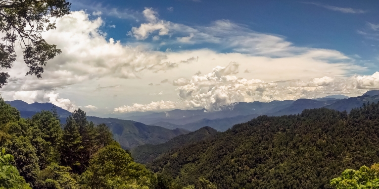 Clouds forming over a mountain valley