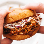 Square picture holding bbq jackfruit sandwich