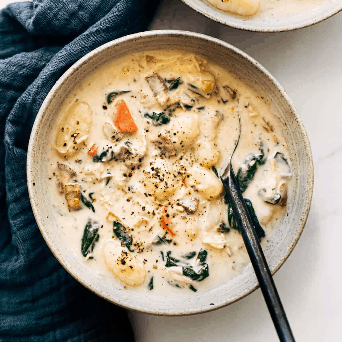 Chicken gnocchi soup in a bowl.